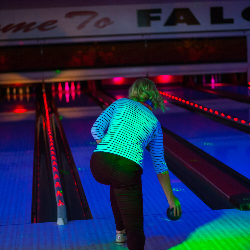 A women laser bowling at Falcon Lanes in Kamloops.