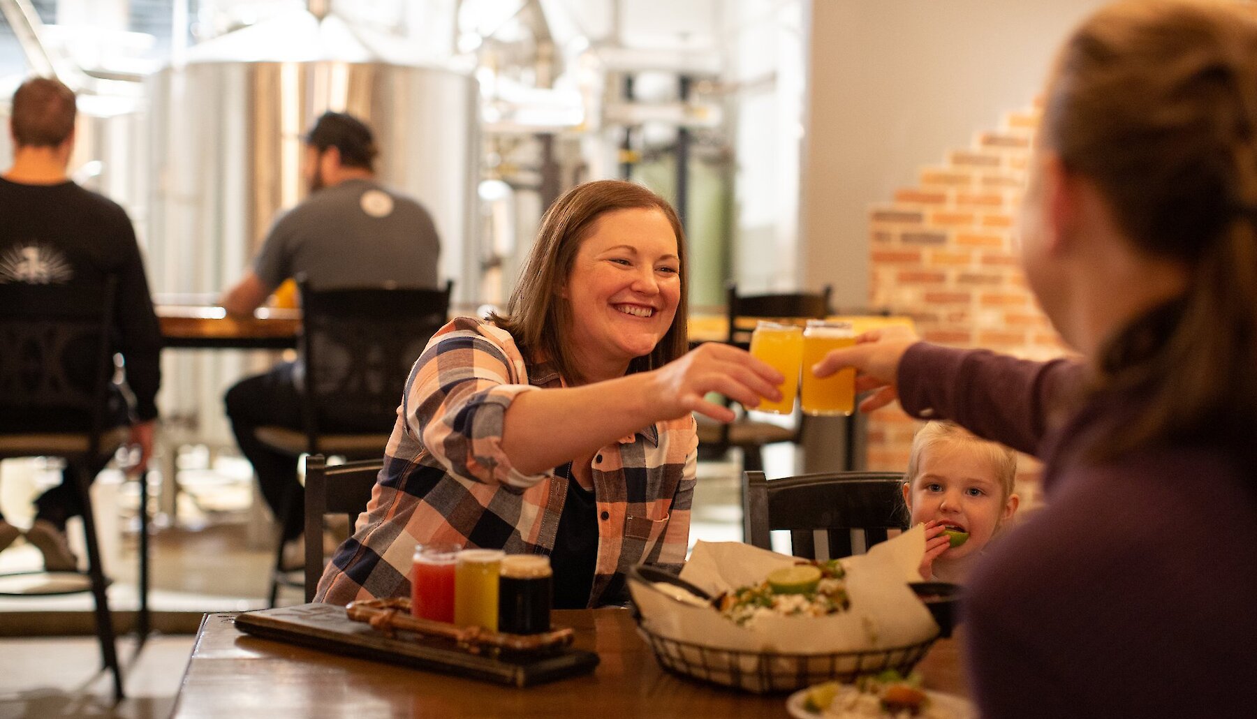 Family enjoying their meal at Iron Road Brewing in Kamloops, BC.
