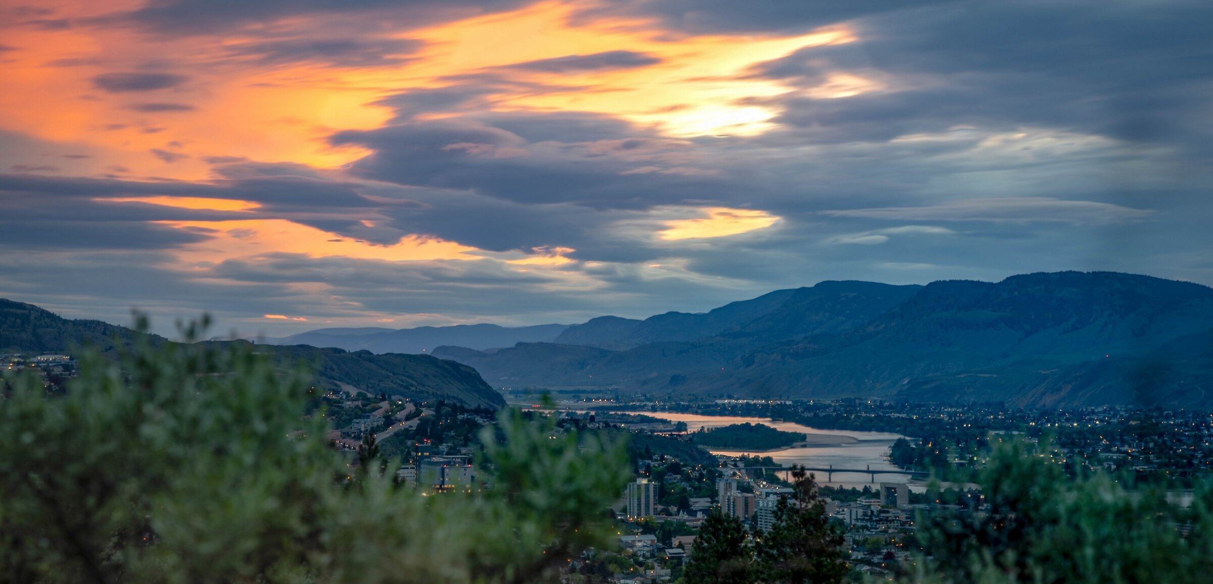 The colourful sunset over Kamloops with the snowy BC mountains in the background.