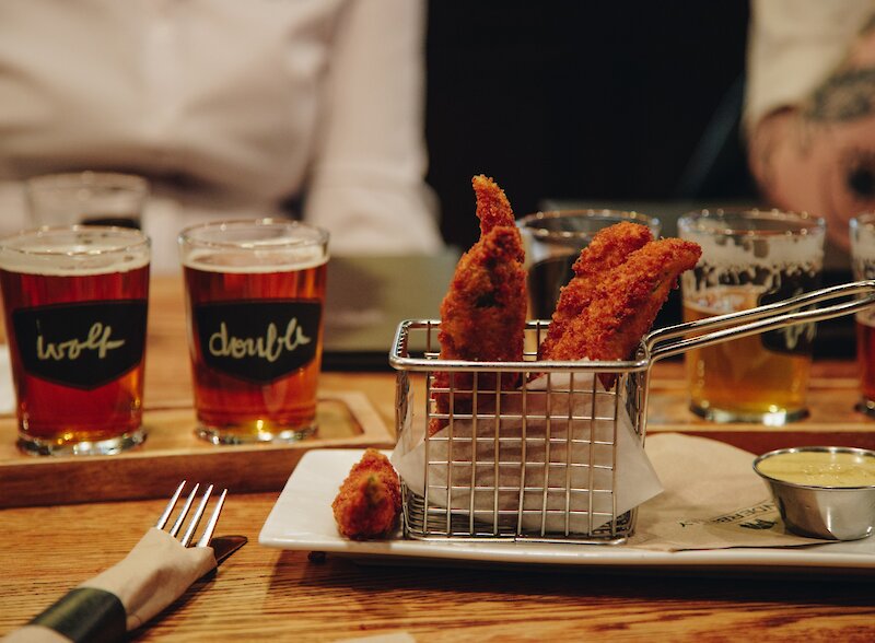 Craft beer and house-made appetizers at Noble Pig Brewhouse in Kamloops, BC.
