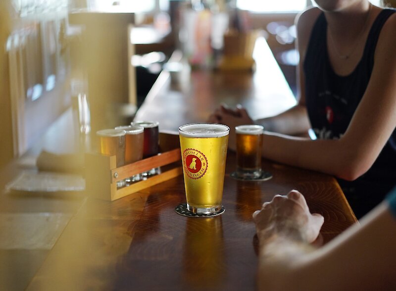 Guests enjoying beer at Red Collar Brewing taproom in Kamloops, BC.