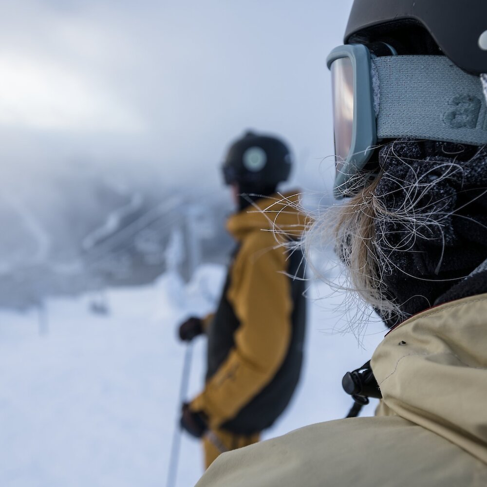 Skiers admiring the mountain view at Sun Peaks Ski Resort.